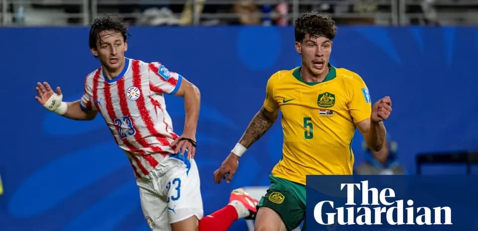 Players from Paraguay and Australia competing for possession