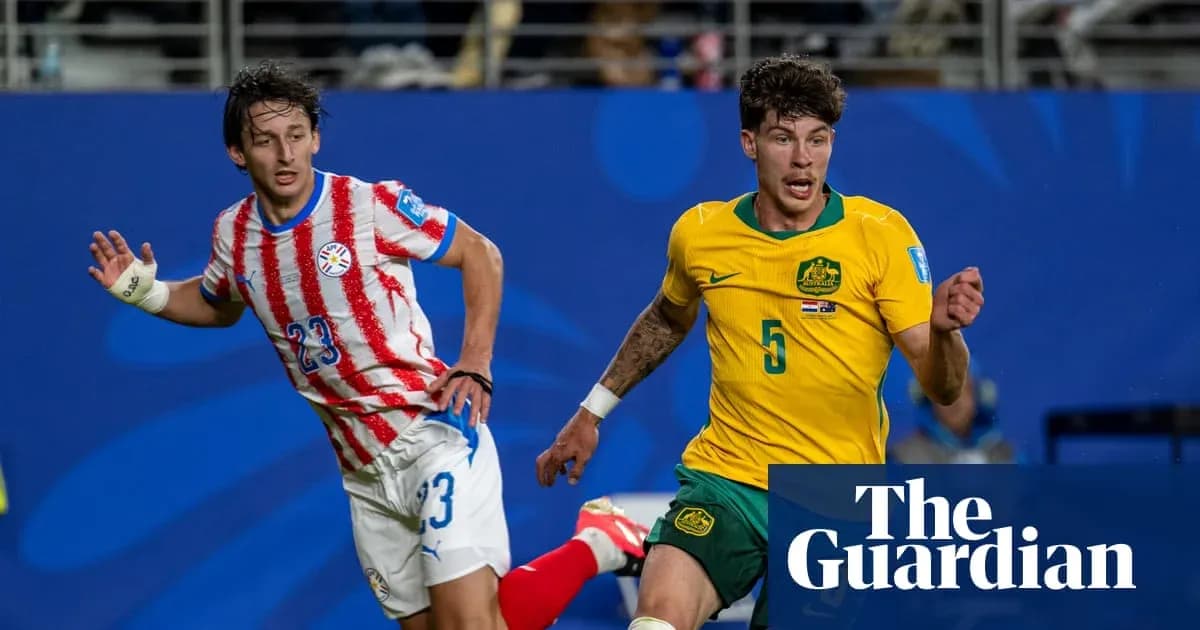 Players from Paraguay and Australia competing for possession