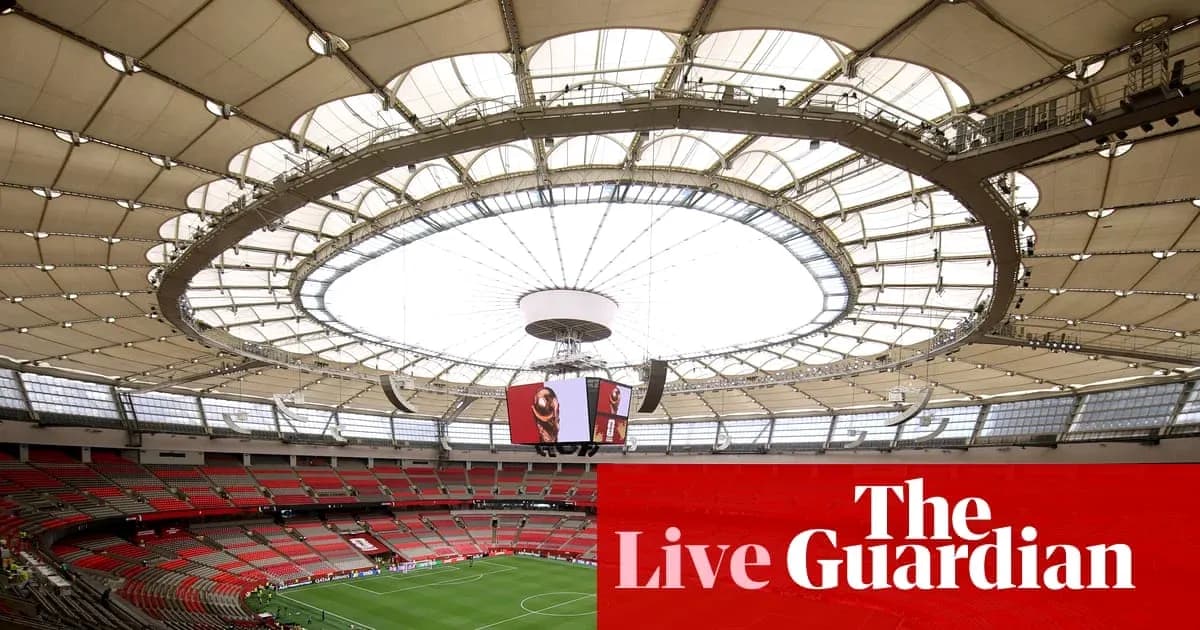 Interior view of a large sports stadium with roof