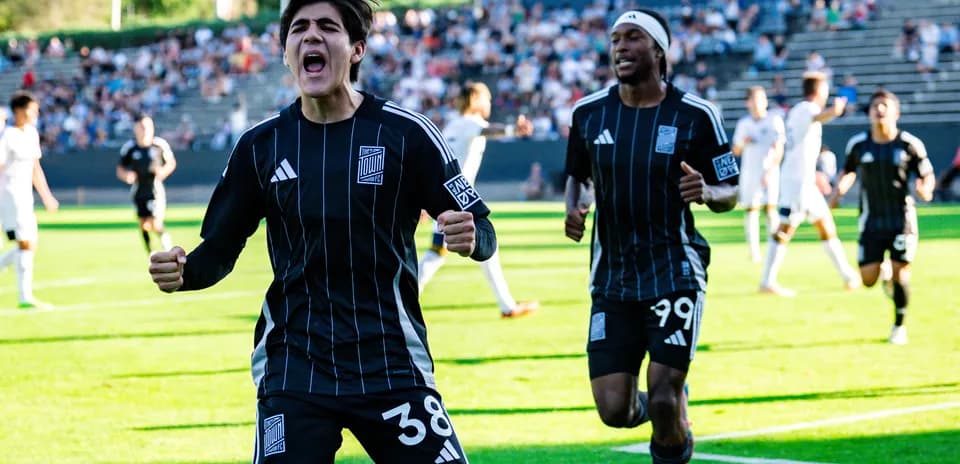 Players celebrating a goal during Town match