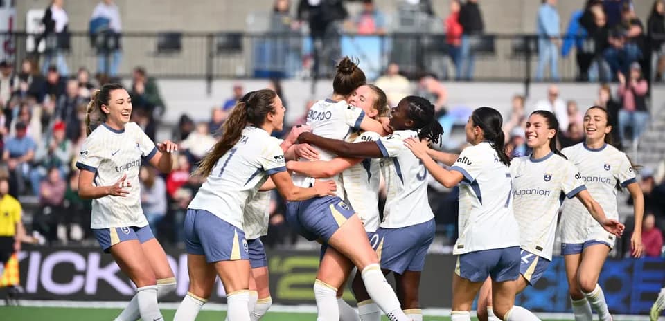 Players celebrating a goal during match