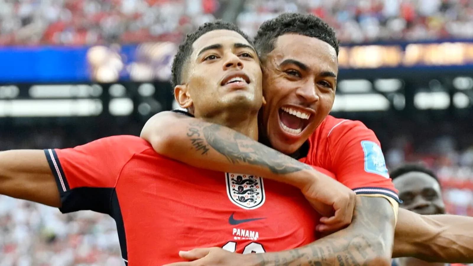 Two players celebrating together on the field