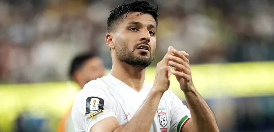 Player applauding fans during match on field