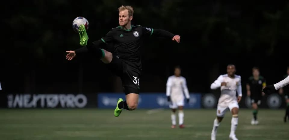 Player kicking ball during Tacoma Defiance match