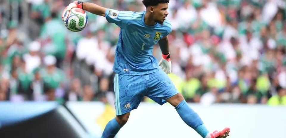 Goalkeeper throwing ball during match action
