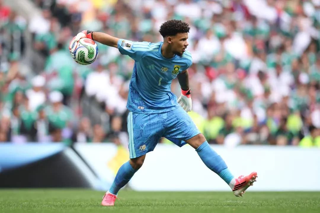 Goalkeeper throwing ball during match action