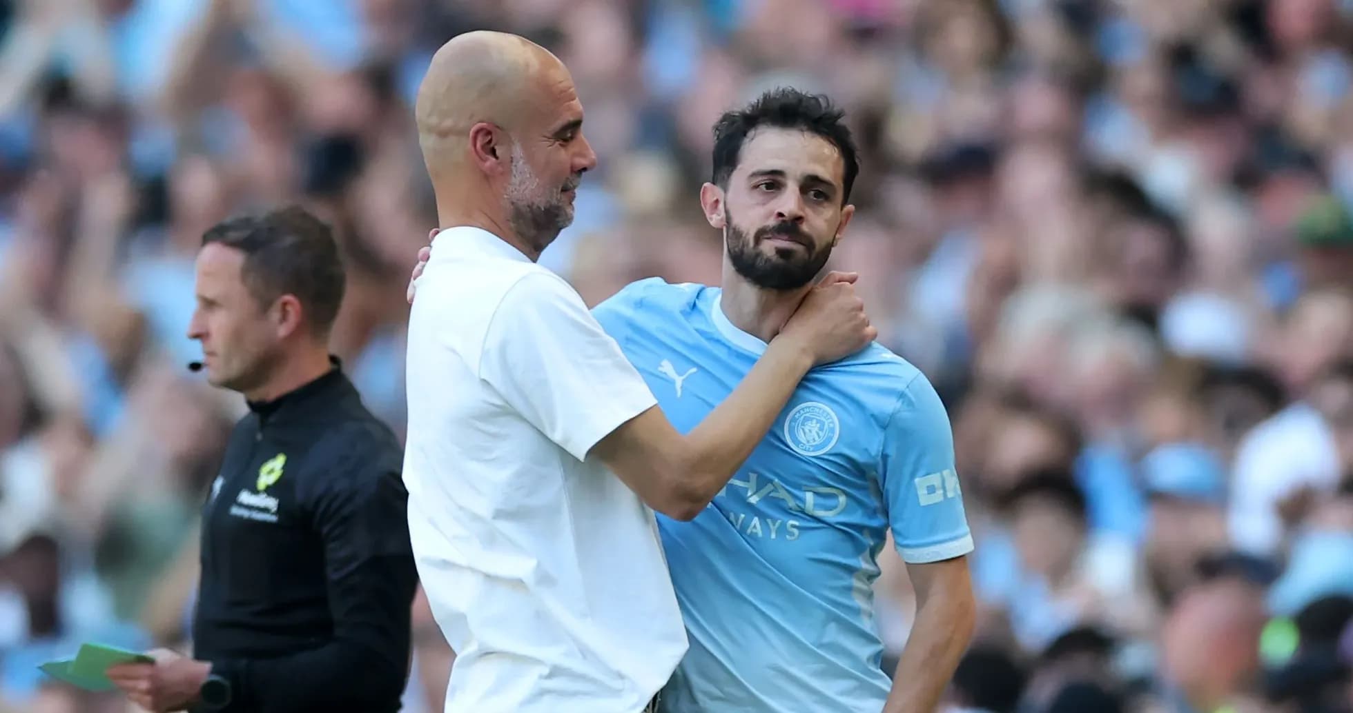Manager and player interacting during match substitution