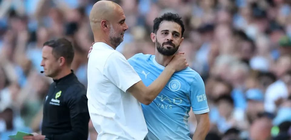 Manager and player interacting during match substitution