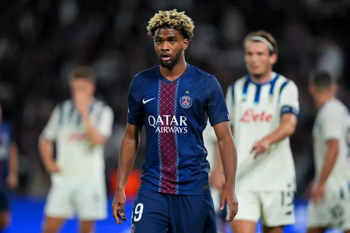 PSG player walking on field during match
