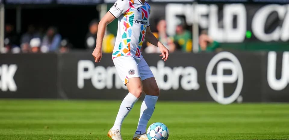 Player dribbling ball during Oakland Roots match