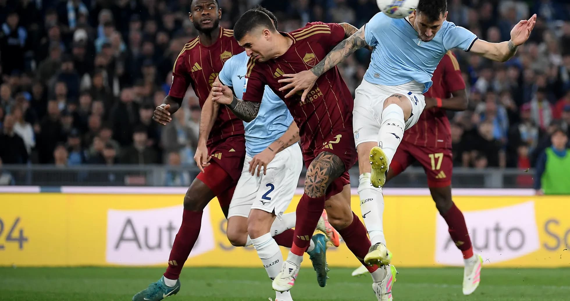 AS Roma players challenging Lazio during match