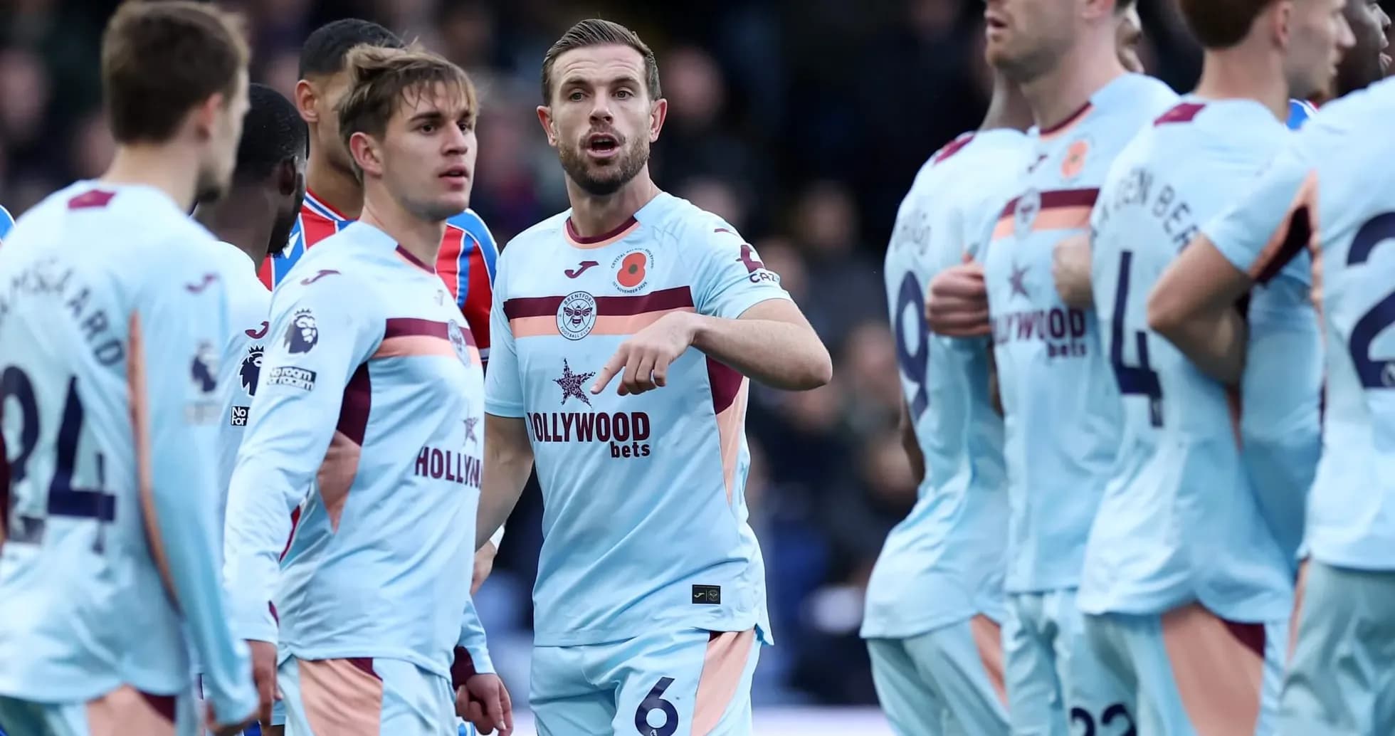 Brentford players discussing during match against Crystal Palace