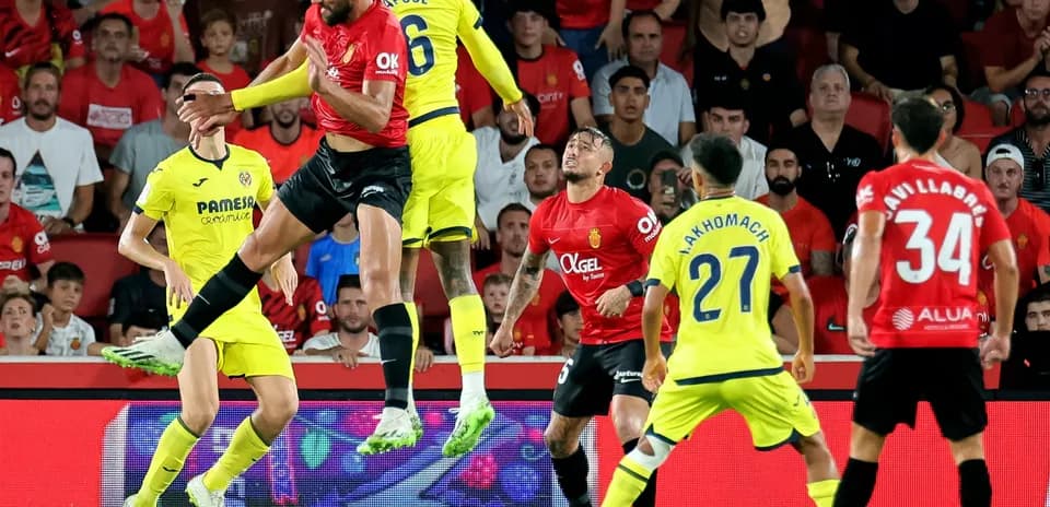 Players contesting for the ball in La Liga match