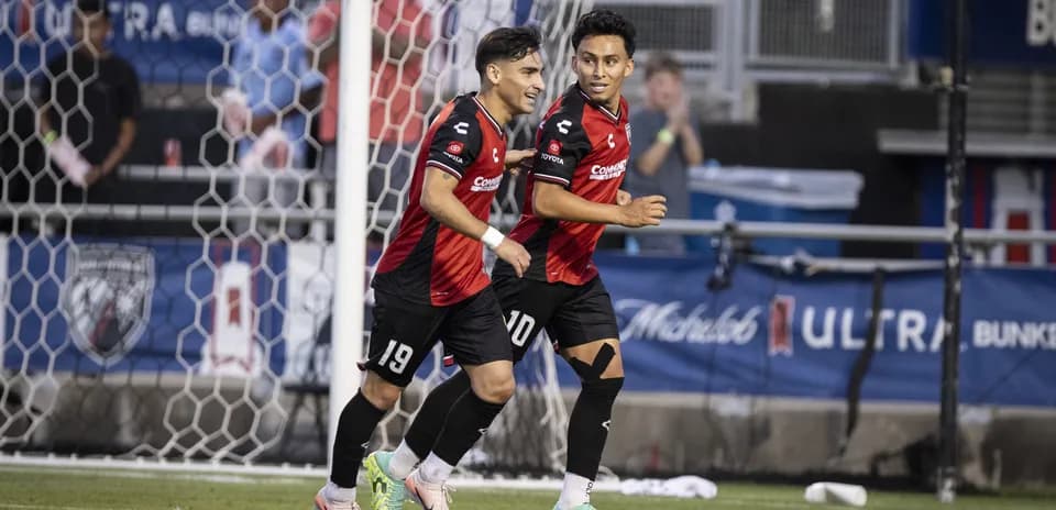 Players celebrating after scoring a goal