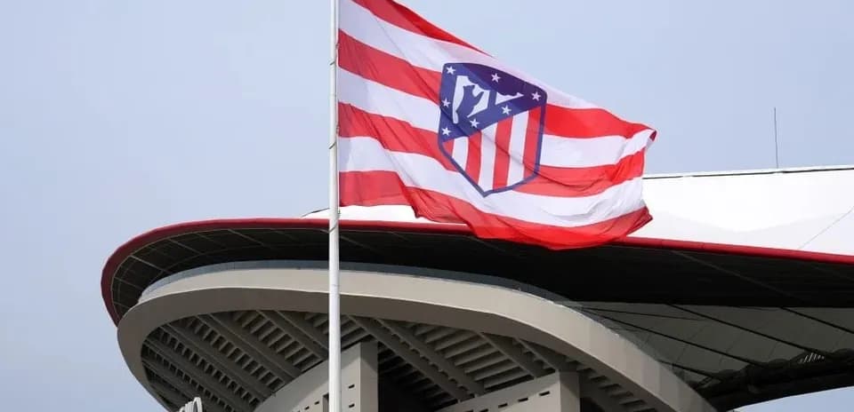 Atletico Madrid flag flying at stadium entrance