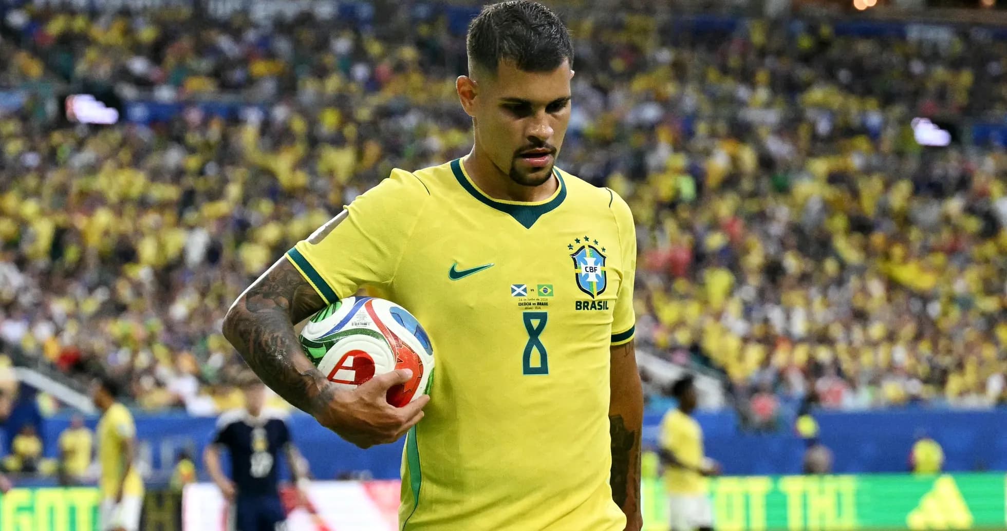 Brazilian player holding a soccer ball during match