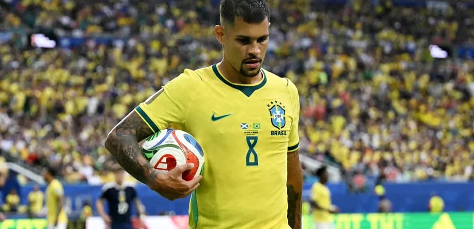 Brazilian player holding a soccer ball during match