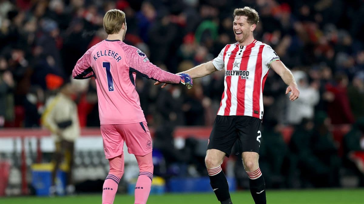 Two players celebrating on the pitch after match