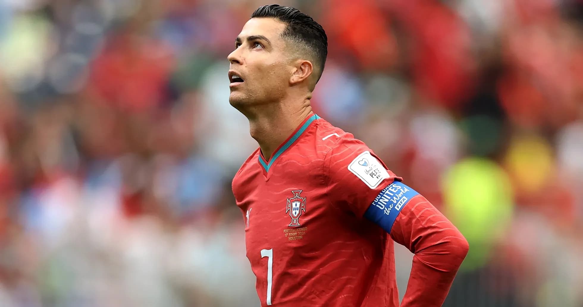 Player looking up during a match wearing Portugal jersey