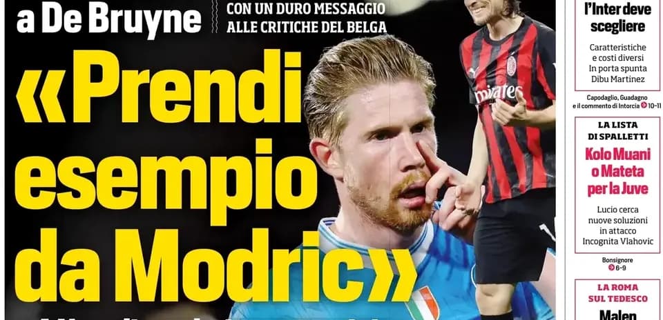 De Bruyne with a finger on his face, Modric in background