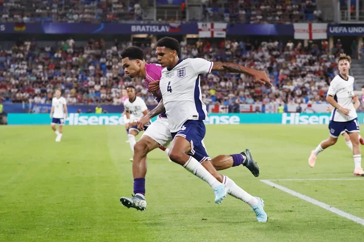 Players competing for the ball during UEFA match