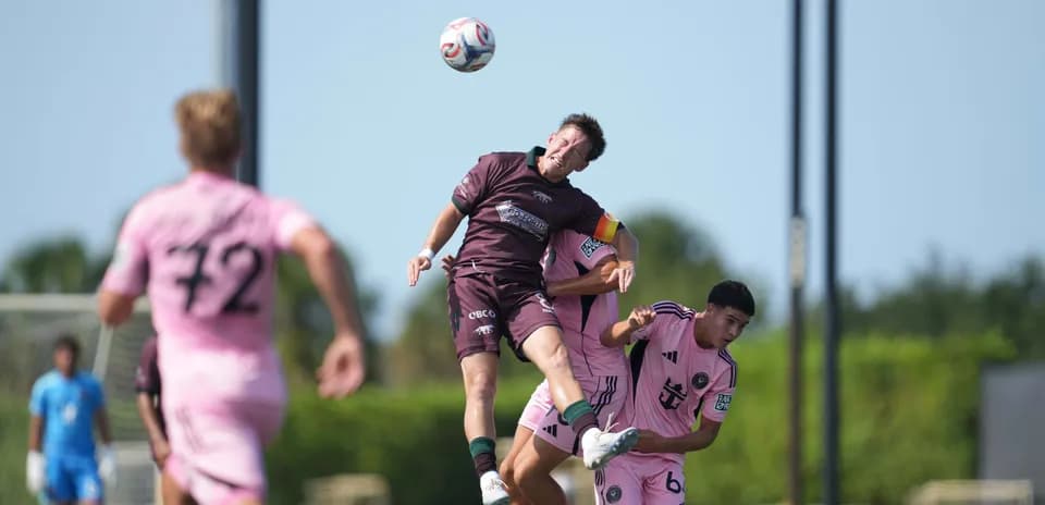 Player challenging for the ball in MLS Next Pro