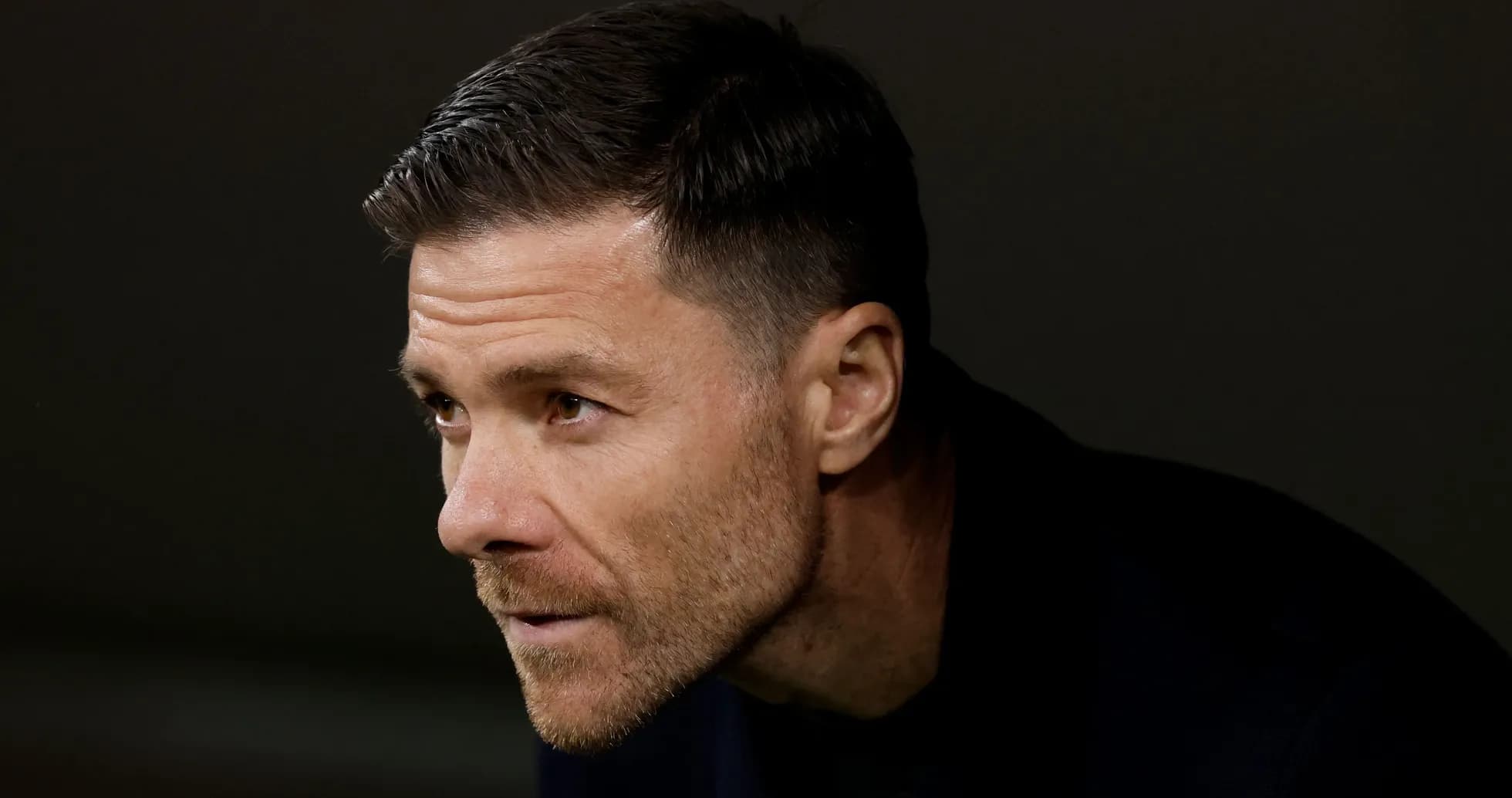 Coach observing from the sidelines during match