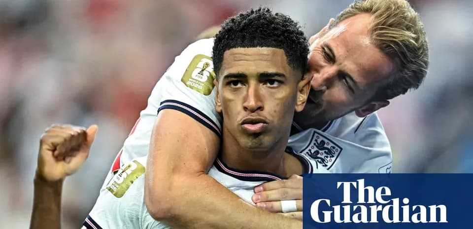 Two England players celebrating after a goal