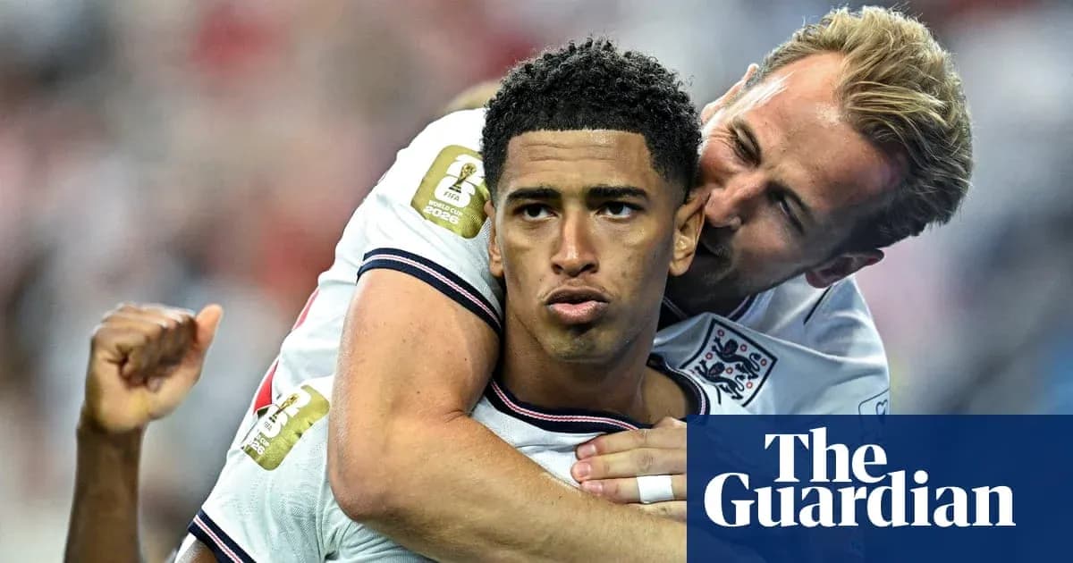 Two England players celebrating after a goal