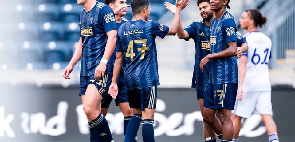Players celebrating during Orlando City II match