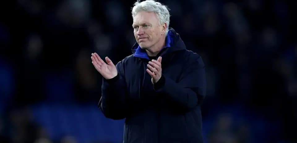 Manager applauding fans after a match