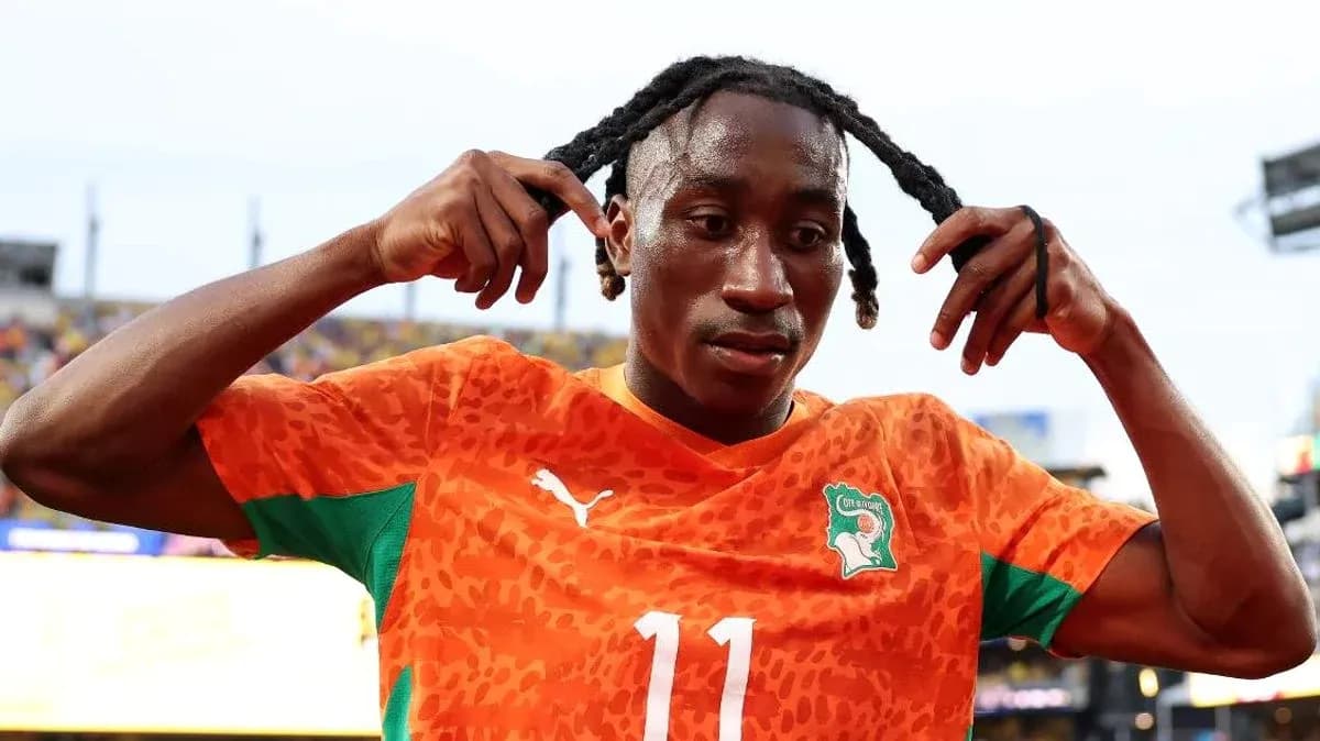 Player adjusting his hair after the match