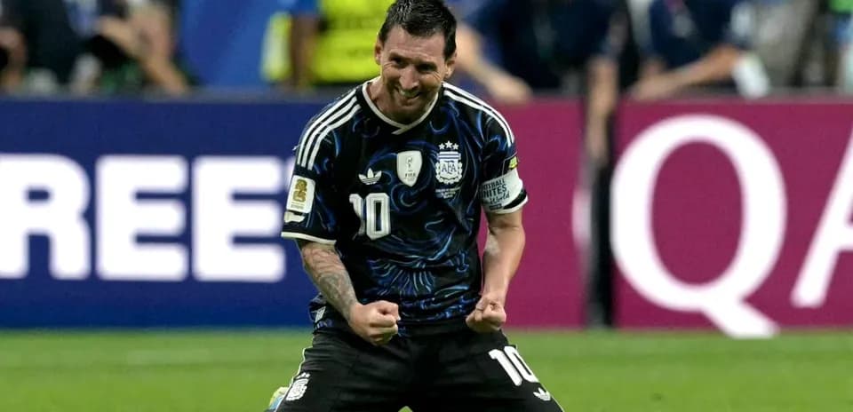 Player celebrating on knees after scoring goal