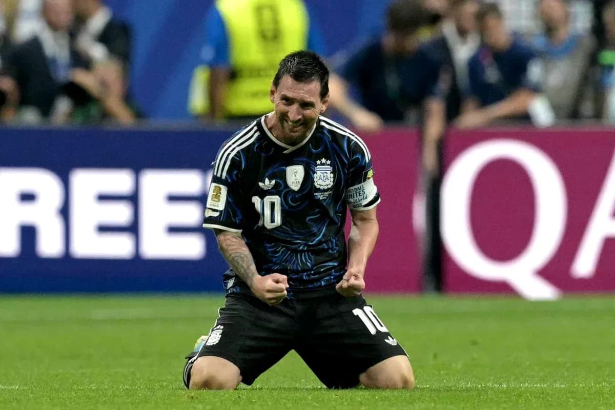 Player celebrating on knees after scoring goal