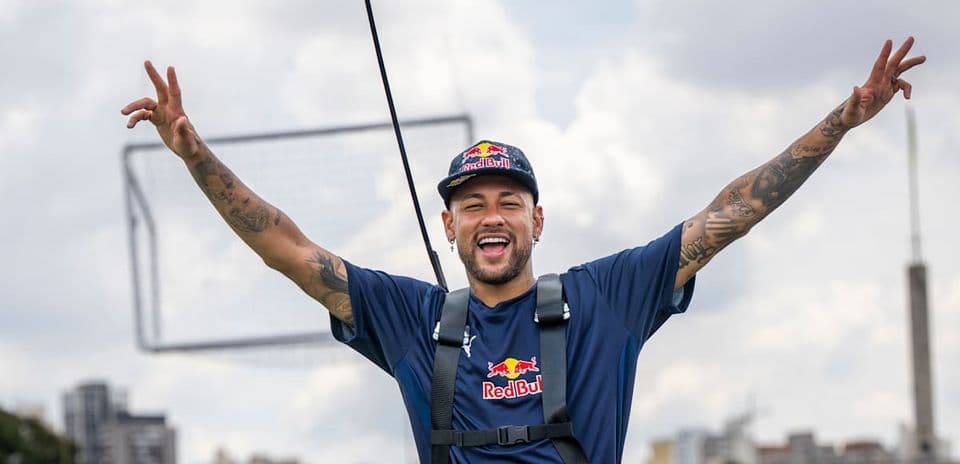 Neymar celebrating in a harness outdoors