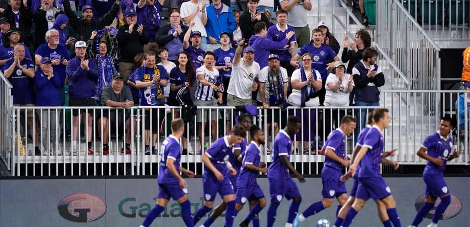 Louisville City fans celebrating during a match
