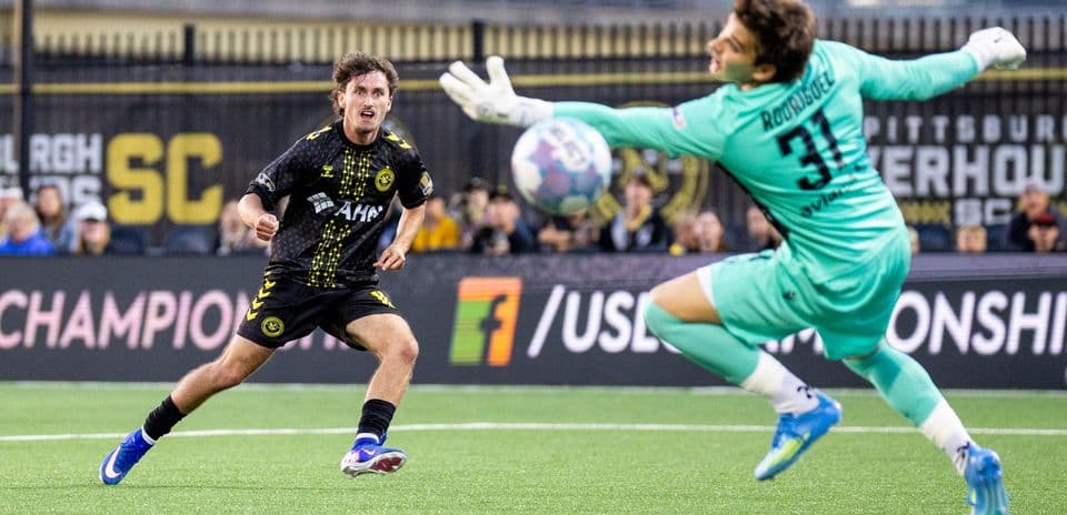 Pittsburgh Riverhounds player shooting on goal