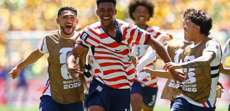 Players celebrating a goal during World Cup match