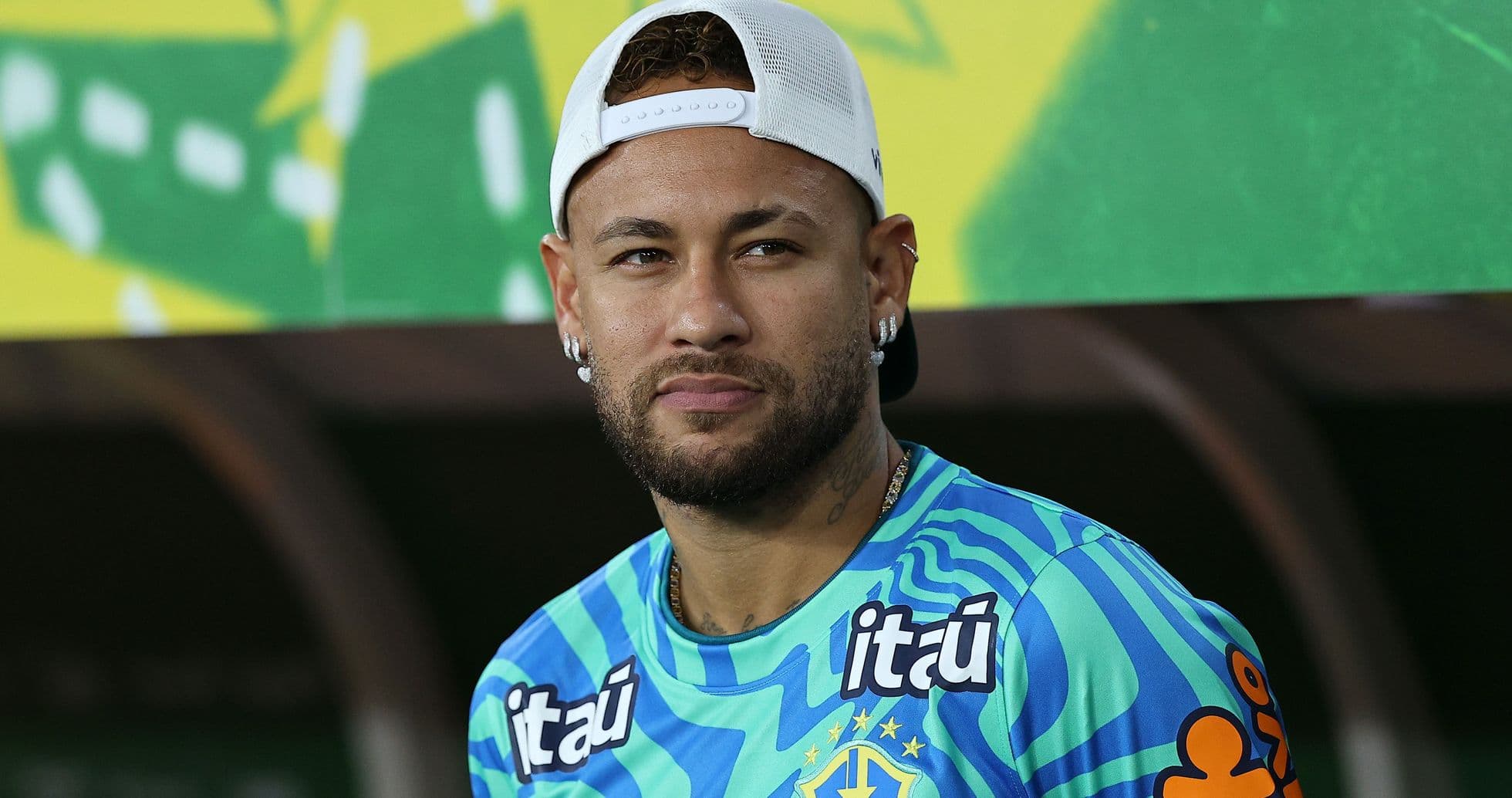 Football player wearing training kit and cap