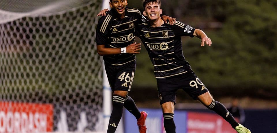 Two Los Angeles FC players celebrating a goal