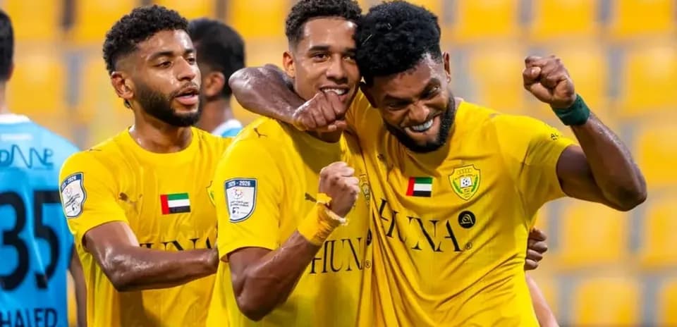 Players celebrating after scoring a goal in match
