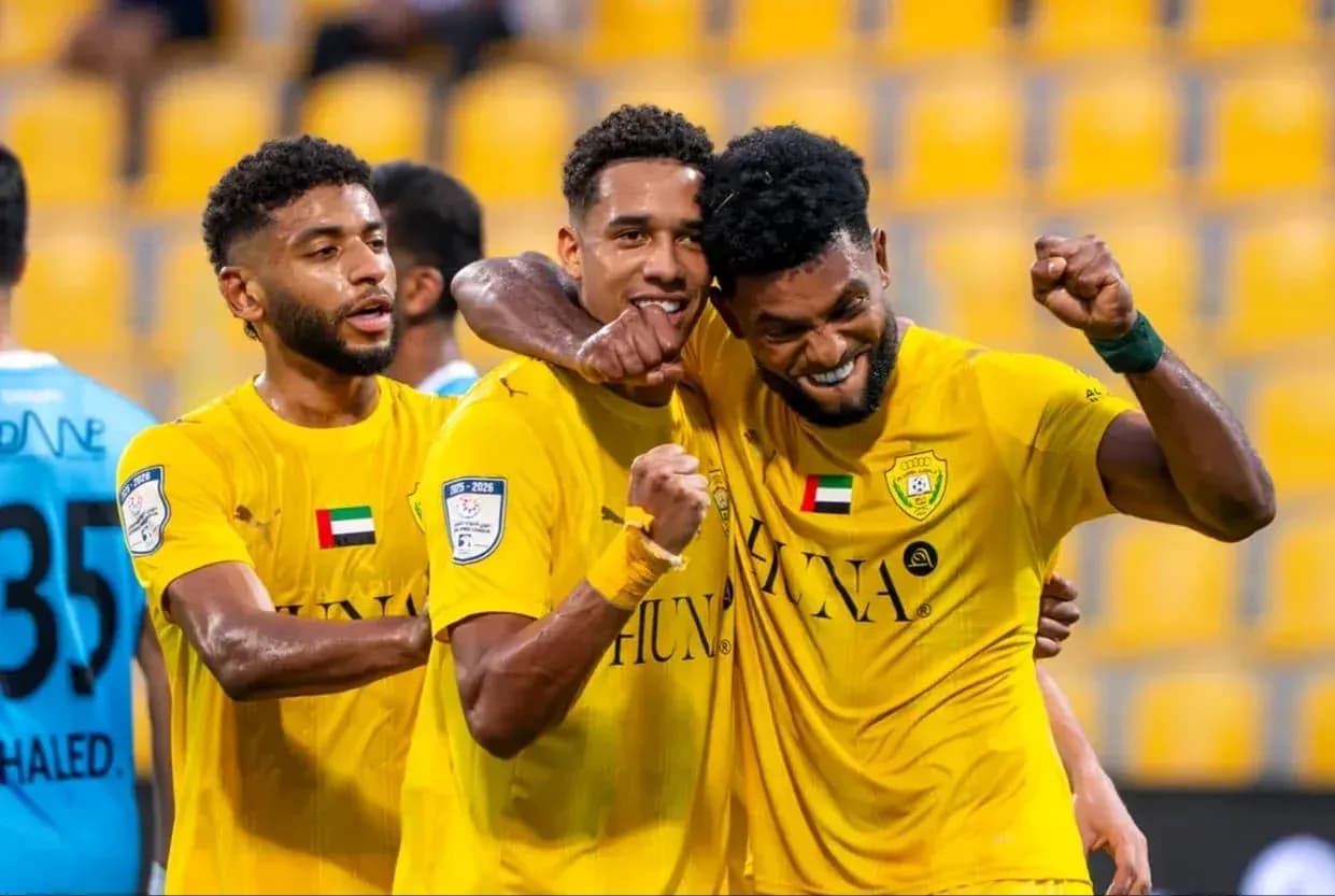 Players celebrating after scoring a goal in match