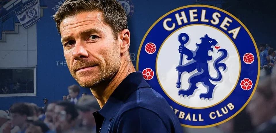 Coach in front of Chelsea Football Club logo