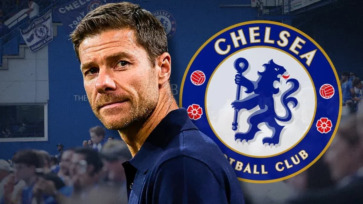 Coach in front of Chelsea Football Club logo