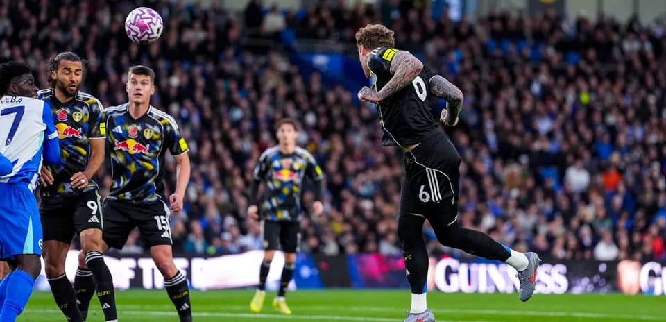Leeds player heading the ball during match