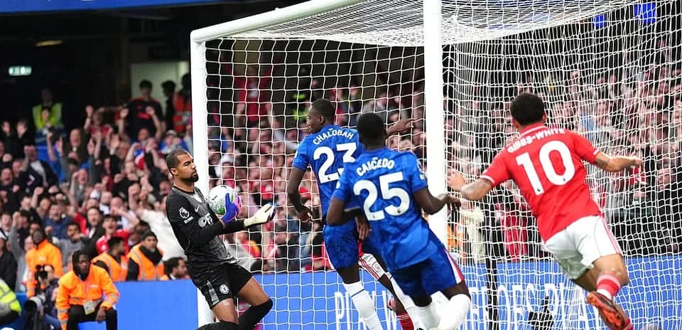 Goalkeeper saving a shot during Chelsea match