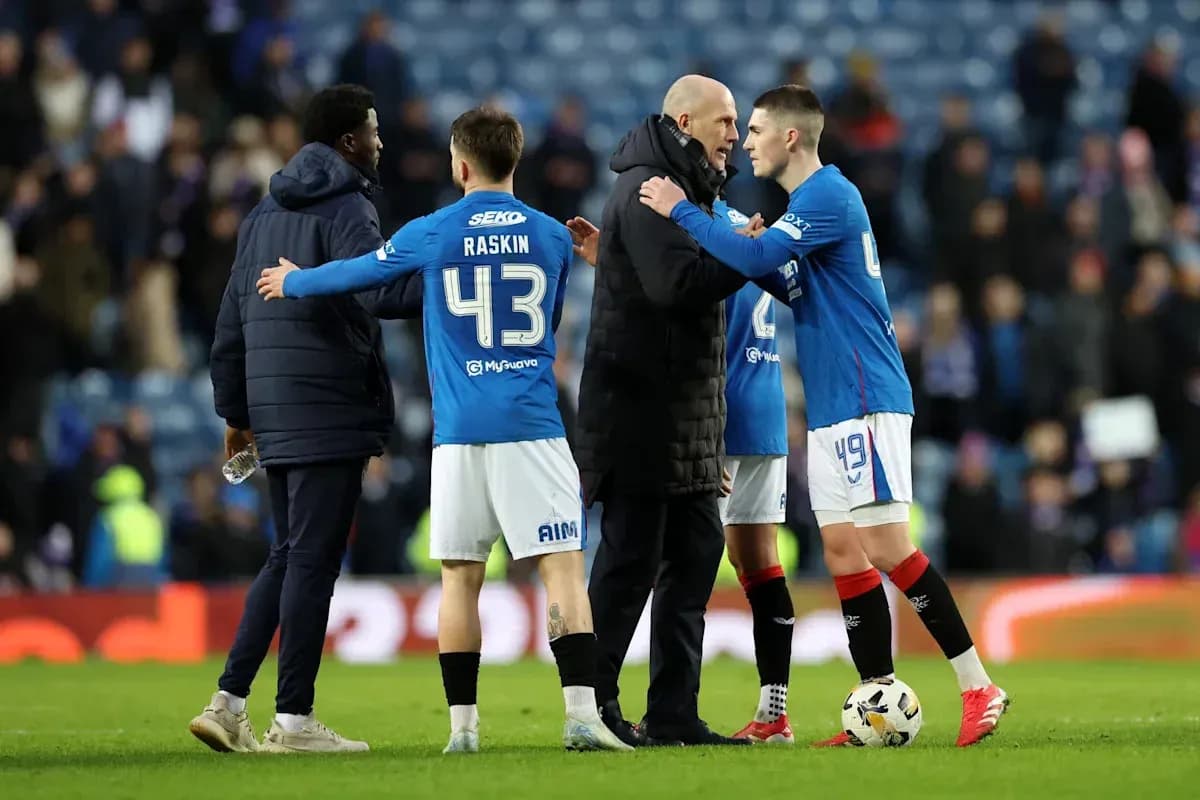 Players and coach discussing after match on field