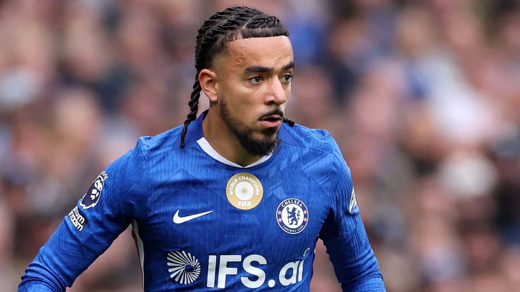 Player in blue Chelsea kit during match action