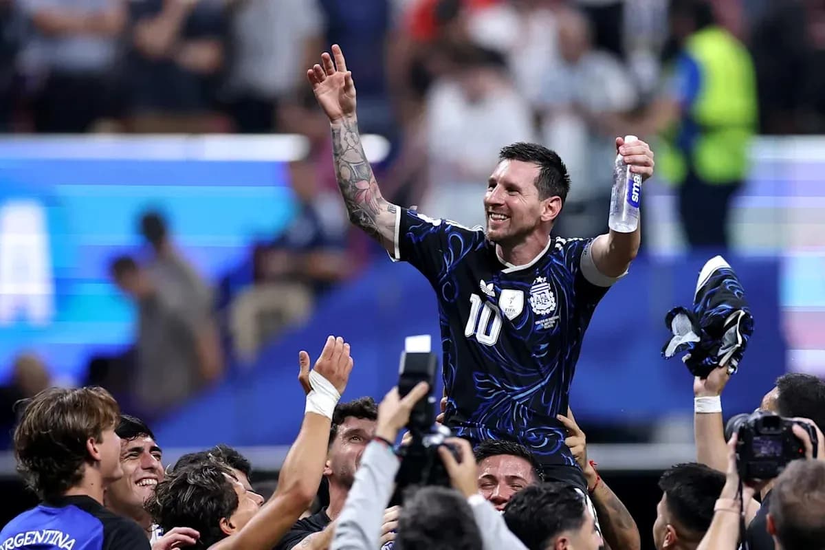 Player celebrating while being lifted by teammates