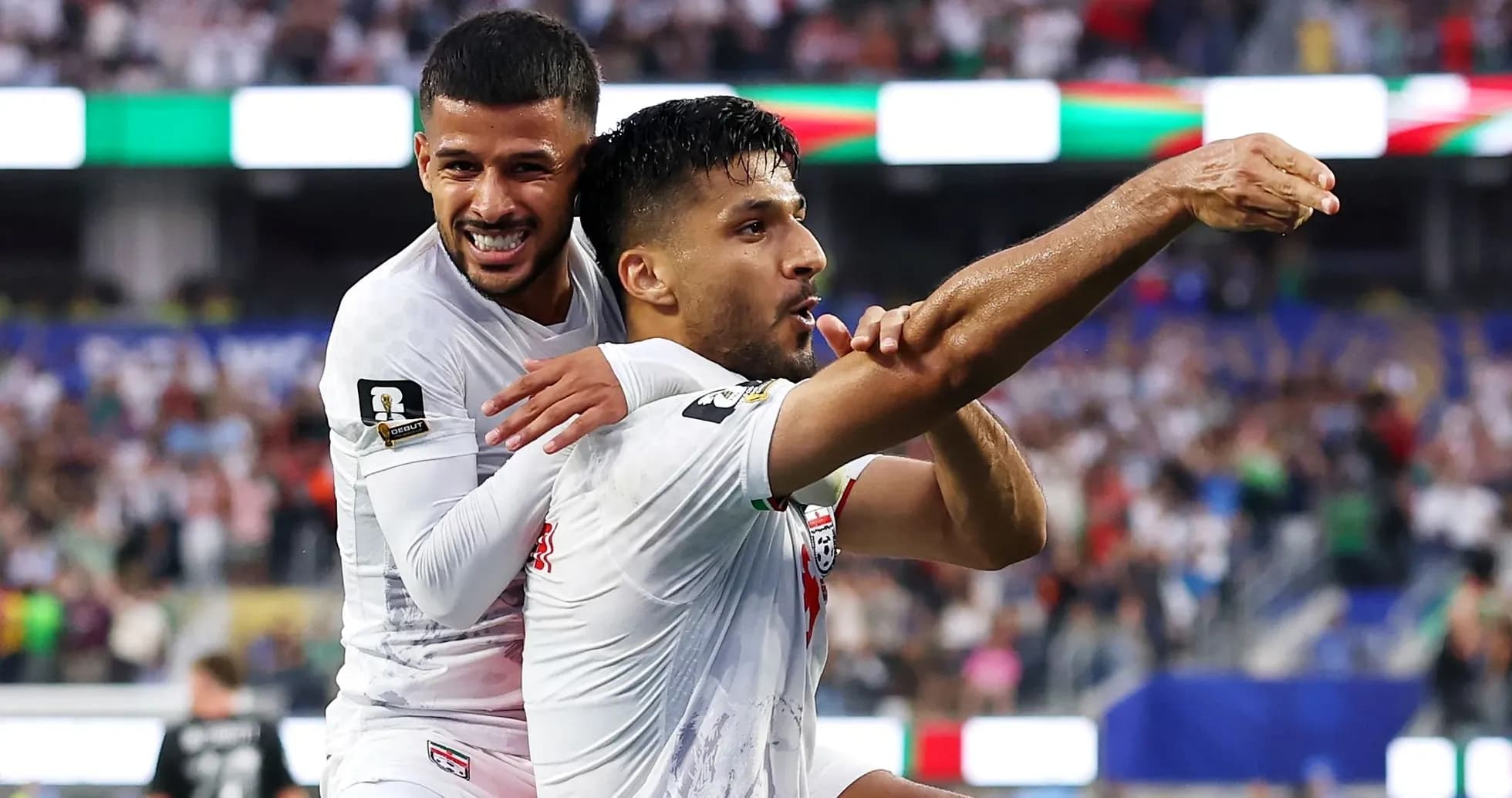 Two players celebrating a goal during match